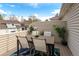 Deck showcasing outdoor dining with seating for four, surrounded by greenery and neighborhood views at 12406 E Pacific Cir # D, Aurora, CO 80014