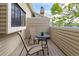 View of the cozy outdoor patio, complete with a small table and chairs at 12406 E Pacific Cir # D, Aurora, CO 80014