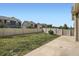 A well-maintained backyard with green grass, a concrete patio, and a privacy fence at 4625 Walden Ct, Denver, CO 80249