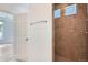 Bathroom features a tiled shower with small windows at 4625 Walden Ct, Denver, CO 80249