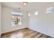 Bedroom with a large window, wood floor, and view of neighborhood at 4625 Walden Ct, Denver, CO 80249