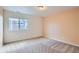 Bedroom with large window and neutral carpet at 4625 Walden Ct, Denver, CO 80249