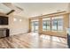Bright open-concept living room with hardwood floors, and a seamless flow to the kitchen at 4625 Walden Ct, Denver, CO 80249