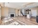 Bright open-concept living room, hardwood floors, fireplace, and seamless flow to the kitchen at 4625 Walden Ct, Denver, CO 80249