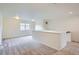 Spacious loft area with neutral carpet, white walls, and ample natural light from a window at 4625 Walden Ct, Denver, CO 80249