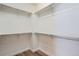 Walk-in closet with shelves and wood floor at 4625 Walden Ct, Denver, CO 80249