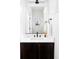 Modern bathroom featuring a dark vanity with a white countertop and sleek fixtures at 7811 E 123Rd Ave, Thornton, CO 80602