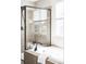 Bright bathroom showcasing a modern bathtub, glass enclosed shower, and neutral tile at 7811 E 123Rd Ave, Thornton, CO 80602