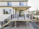 Back deck with stairs and metal railings, offering an outdoor area for relaxing and entertaining at 7811 E 123Rd Ave, Thornton, CO 80602