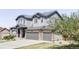 Charming two-story home with a three-car garage and manicured lawn at 7811 E 123Rd Ave, Thornton, CO 80602