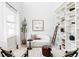 Bright living room featuring stylish seating, built-in bookshelves, and a charming decorative ladder at 7811 E 123Rd Ave, Thornton, CO 80602