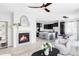 Bright and airy living room featuring a fireplace, modern decor, and open-concept layout at 7811 E 123Rd Ave, Thornton, CO 80602