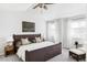 Serene main bedroom with a plush bed, soft lighting, and large windows at 7811 E 123Rd Ave, Thornton, CO 80602