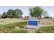 Sign for King Ranch Park in Thornton, CO, indicating a community recreational area with green spaces at 7811 E 123Rd Ave, Thornton, CO 80602