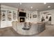 Comfortable basement with a stone fireplace, built-in shelving, and cozy seating area, perfect for Gathering gatherings at 1042 Country Club Estates Dr, Castle Rock, CO 80108