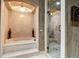 Modern bathroom featuring a soaking tub, a walk-in shower with glass door, and neutral toned walls at 1042 Country Club Estates Dr, Castle Rock, CO 80108