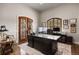 Spacious home office featuring a large desk, natural light, and sophisticated decor, perfect for productivity at 1042 Country Club Estates Dr, Castle Rock, CO 80108