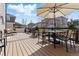 Large back deck featuring a grill, dining set, and comfortable seating, offering an ideal space for outdoor relaxation at 18130 Bolero Dr, Parker, CO 80134