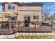 Charming home featuring a wooden deck with outdoor furniture, a grill, and a peaceful backyard setting at 18130 Bolero Dr, Parker, CO 80134