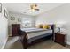 Comfortable bedroom featuring a sleigh bed frame, complementary furniture and bright natural light at 18130 Bolero Dr, Parker, CO 80134