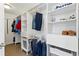 A walk in closet with built-in shelving, hanging racks, and ample storage space at 18130 Bolero Dr, Parker, CO 80134