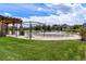 Inviting community pool with lounge chairs, lush landscaping, and plenty of space for relaxing and socializing at 18130 Bolero Dr, Parker, CO 80134