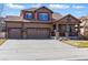 Charming two-story home with a three car garage, covered porch, and well-maintained landscaping at 18130 Bolero Dr, Parker, CO 80134