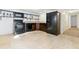 Neutral color palette, tile floors and dark appliances fill this well-lit kitchen at 18130 Bolero Dr, Parker, CO 80134