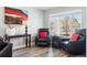 Cozy living room offers comfortable armchairs, a bright window, and stylish decor, perfect for relaxation at 18130 Bolero Dr, Parker, CO 80134