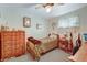 Comfortable bedroom with a soft bed, vintage furniture, and natural light from the window at 518 Cherry St, Hudson, CO 80642