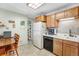 The kitchen offers ample storage, tiled backsplash, and a view into the pantry at 518 Cherry St, Hudson, CO 80642