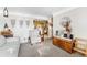 Open-concept living room with stylish seating, modern decor, and a view into the kitchen at 518 Cherry St, Hudson, CO 80642