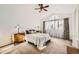 Sunlit bedroom featuring a vaulted ceiling, large window, and plush carpet at 2228 Gold Dust Trl, Highlands Ranch, CO 80129