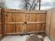 View of the backyard with a grass lawn and a shed in the back corner of the lot at 5618 Carr St, Arvada, CO 80002
