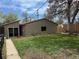 View of the backyard with a grass lawn and a shed in the back corner of the lot at 5618 Carr St, Arvada, CO 80002