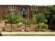 Landscaped backyard featuring a garden bed, fountain, and decorative fencing at 5618 Carr St, Arvada, CO 80002