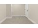 Carpeted basement room with neutral walls, white trim, and ample space at 1045 Locust St, Denver, CO 80220
