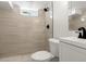 Updated bathroom features a tiled shower, modern fixtures, and neutral color scheme at 1045 Locust St, Denver, CO 80220