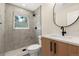 Stylish bathroom with a marble tile shower, modern vanity, and sleek fixtures at 1045 Locust St, Denver, CO 80220