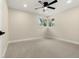 Cozy bedroom with neutral carpet, corner windows, and a modern ceiling fan at 1045 Locust St, Denver, CO 80220