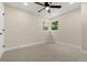 Comfortable bedroom with soft carpet, natural light, and a modern ceiling fan at 1045 Locust St, Denver, CO 80220