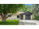 Charming ranch-style home with white brick, dark trim, and a well-manicured lawn at 1045 Locust St, Denver, CO 80220