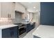 Modern kitchen with white countertops, farmhouse sink, and stainless steel appliances at 1045 Locust St, Denver, CO 80220