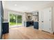 Bright kitchen with modern appliances, cabinetry, and sliding glass doors to the yard at 1045 Locust St, Denver, CO 80220