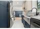 The kitchen showcases stainless steel appliances, a modern faucet, and an open layout at 1045 Locust St, Denver, CO 80220