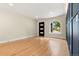 Bright and airy living room with hardwood floors, modern lighting, and an arched window at 1045 Locust St, Denver, CO 80220