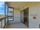 Balcony with sliding door and an exterior brick wall at 13850 E Marina Dr # 506, Aurora, CO 80014