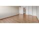 This bedroom boasts wood floors, access to a bathroom, storage closet and bright natural light at 13850 E Marina Dr # 506, Aurora, CO 80014