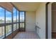 Enclosed patio with tile floor, bamboo blinds, and view of trees and the sky at 13850 E Marina Dr # 506, Aurora, CO 80014