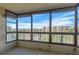 Enclosed patio featuring bamboo blinds and views of trees and neighboring buildings at 13850 E Marina Dr # 506, Aurora, CO 80014